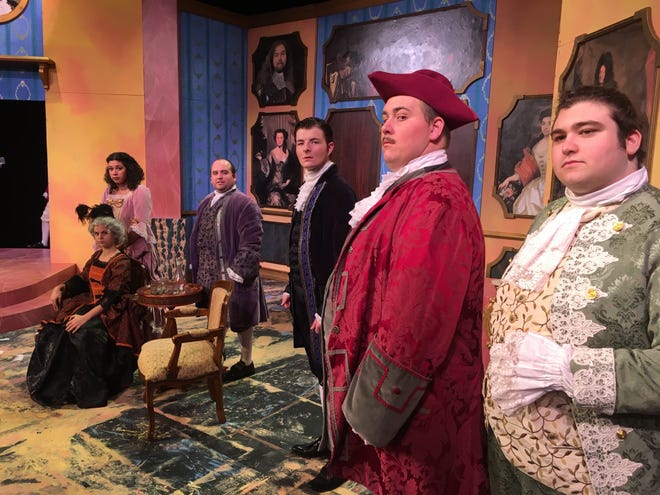 The cast of 'Tartuffe' poses during a dress rehearsal at Gulf Coast State College in Panama City on Tuesday. TONY SIMMONS/The News Herald