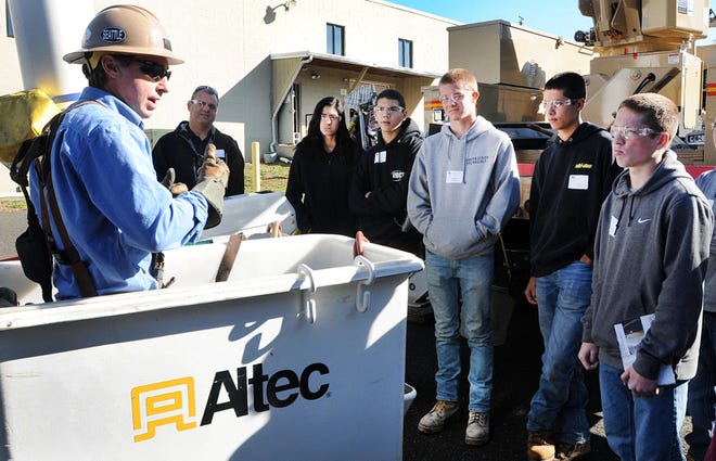 Erik Myers (left), from the Tri-M group, talks to a group of students from the Upper Bucks County Technical School inside his boom lift about safety in the workplace. ABC Inc. in Harleysville and Worth & Co. of Plumstead teamed up for a Construction Career Day on Thursday. Souderton High School students also attended.