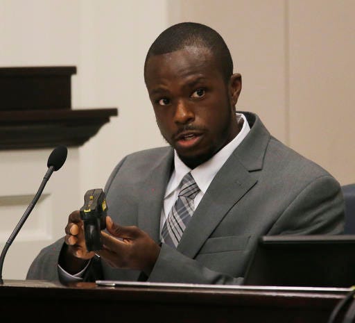 Samuel Stewart a DNA analyst from the South Carolina Law Enforcement Division speaks during the murder trial of former North Charleston Police Officer Michael Slager, Thursday, Nov. 10, 2016, in Charleston, S.C. Slager is on trial facing a murder charge in the shooting death of Walter Scott, who was gunned down after he fled from a traffic stop. Ninth Circuit Solicitor Scarlett Wilson is seen at left. (Grace Beahm/Post and Courier via AP, Pool)