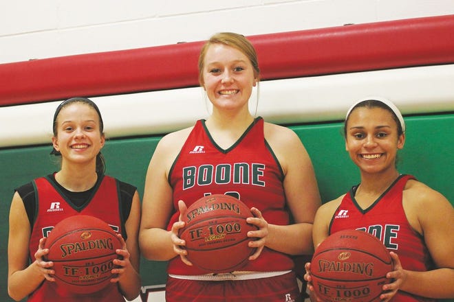 From left, Mady Danner, Claire Sandvig and Caitlynne Shadle return to the basketball court with hopes of bettering last year's postseason showing. Practices started Monday morning for most teams around the state, giving Boone two weeks before its first game.