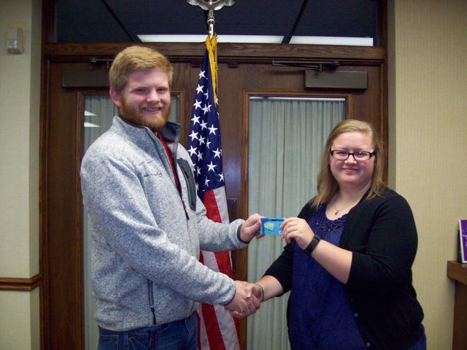 The Cuba High School Student Council has chosen Scott Marlow, the son of Jodi and Jeff Marlow of Smithfield, as the November Senior of the Month. Presenting a $50 U.S. gift card to Scott Marlow is Jayme Jorgensen from MidAmerica National Bank.