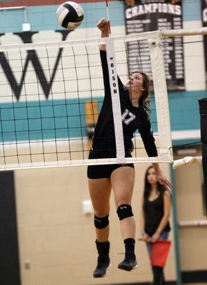Forestview's Morgan Ginther sends the ball across the net in their opening round playoff victory over South Rowam Wednesday. Forestview defeated South Rowan 3-2 (25-15, 23-25, 25020, 20-25, 15-11). Brian Mayhew / Special to the Gazette