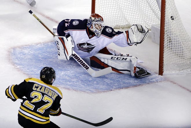 Bruins center Austin Czarnik scores on Blue Jackets goalie Sergei Bobrovsky during the first period of Boston's 5-2 win on Thursday night.