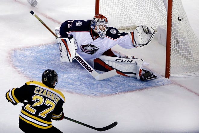 Boston Bruins center Austin Czarnik scores past Columbus Blue Jackets goalie Sergei Bobrovsky in the first period of an NHL hockey game, Thursday, Nov. 10, 2016, in Boston.