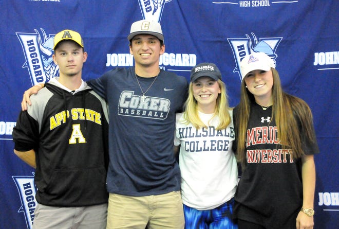 J.P. Price (from left), Rob Wilkerson, Madie Schider and Kendall Goldblum had a signing day ceremony at Hoggard High School on Thursday. TIM HOWE/STARNEWS