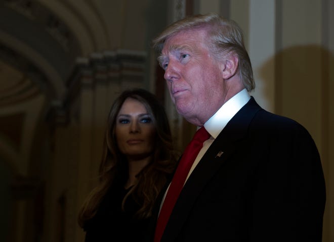 President-elect Donald Trump, accompanied by his wife Melania, speaks to the media on Capitol Hill in Washington, Thursday, Nov. 10, 2016, following a meeting with Senate Majority Leader Mitch McConnell of Ky. (AP Photo/Molly Riley)