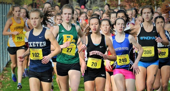 Exeter's Jackie Gaughan, second from left, will make a run at today's New England title. Also pictured are local runners Danielle Slavin of Oyster River and Coe-Brown's Alli Pratt (over Slavin's left shoulder), who will be competing as well. Mike Whaley/Fosters.com