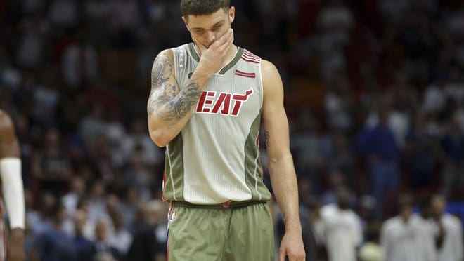 Miami Heat's Tyler Johnson (8) walks on the court during the second half of an NBA basketball game against the Chicago Bulls, Thursday, Nov. 10, 2016, in Miami. (AP Photo/Lynne Sladky)