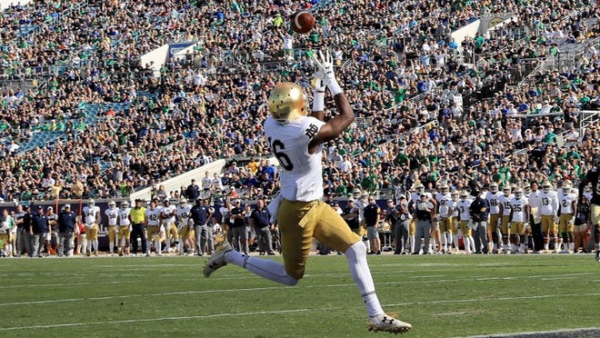 Torii Hunter Jr. #16 of the Notre Dame Fighting Irish attempts a reception during the game against the Navy Midshipmen at EverBank Field on November 5, 2016 in Jacksonville, Florida. (Photo by Sam Greenwood/Getty Images)