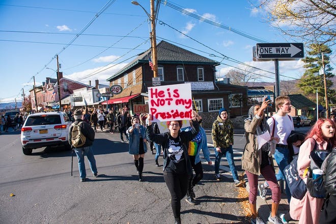 Hundreds of protesters march on Route 299 in New Paltz on Friday.