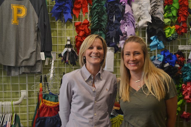 Hilary Butschek/Staff Casey LeMons (left) and Jenny Youngblood purchased the Watkinsville store, A Child’s Closet, in April 2015.