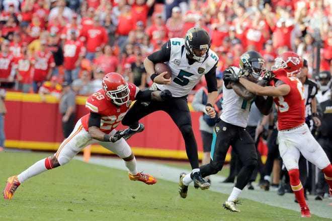 Jaguars quarterback Blake Bortles (5) is tackled by Kansas City Chiefs defensive back Eric Berry (29) during the second half last week. (Associated Press)