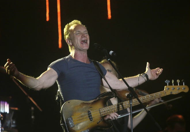 FILE - In this March 5, 2016 file photo, musician Sting performs during a concert at the Java Jazz Festival in Jakarta, Indonesia. A concert by British pop legend Sting is marking the reopening of the ParisþÄô Bataclan concert hall one year after suicidal jihadis turned it into a bloodbath and killed 90 revelers with automatic weapons and explosive belts. (AP Photo/Tatan Syuflana, File)