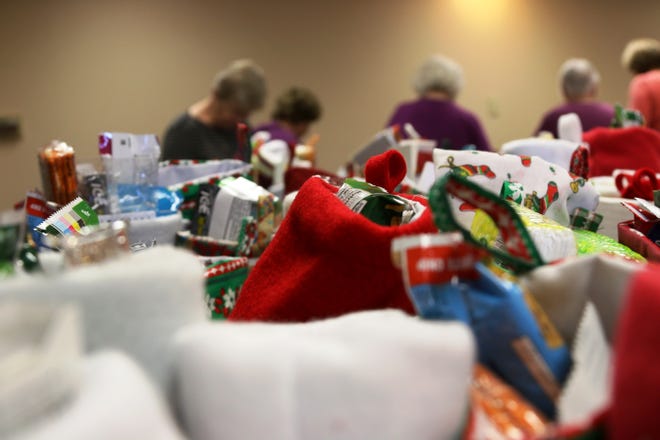 The Sinnissippi Quilters filled 2,000 stockings on Friday, Nov. 4, 2016, at the Tebala Event Center in Rockford as part of its Stockings for Soldiers program. MAGGIE HRADECKY/STAFF PHOTOGRAPHER/RRSTAR.COM