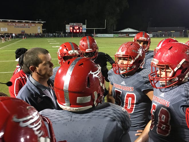 Bradford coach Corey Green talks to his team in the second quarter of Friday's game against Dunnellon in Starke. (Scott LaPeer/Correspondent)