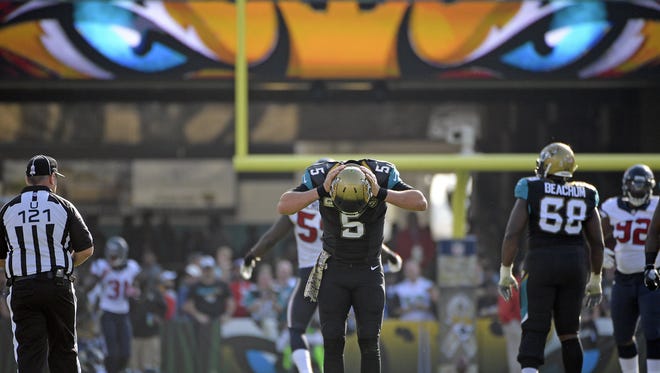 Jacksonville Jaguars quarterback Blake Bortles (5) reacts after throwing an incomplete pass to an open receiver against the Houston Texans during Jacksonville’s 24-21 loss. (AP Photo/Phelan M. Ebenhack)