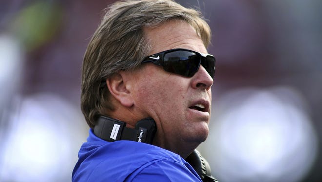 Florida’s coach Jim McElwain looks to the scoreboard during the second half of an NCAA college football game against Arkansas Saturday, Nov. 5, 2016 in Fayetteville, Ark. Arkansas beat Florida 31-10. (AP Photo/Samantha Baker)