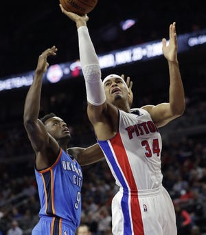 Detroit Pistons forward Tobias Harris (34) makes a layup defended by Oklahoma City Thunder forward Jerami Grant (9) during the first half of an NBA basketball game, Monday, Nov. 14, 2016, in Auburn Hills, Mich. (AP Photo/Carlos Osorio)