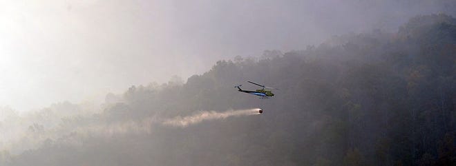 Crews continue to attack the Party Rock wildfire near Lake Lure.