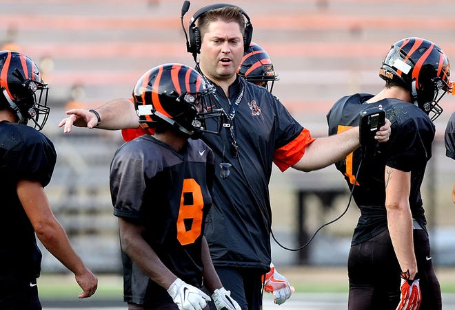 Massillon varsity football coach Nate Moore works with his players during a scrimmage against Avon this season.

 (IndeOnline.com / Kevin Whitlock)