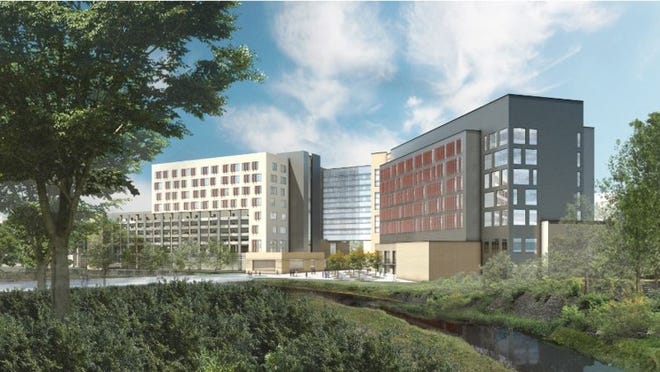 Rendering of UT Dell Medical School Parking Garage/Medical Office Building and Research Building (the view is from Waller Creek).