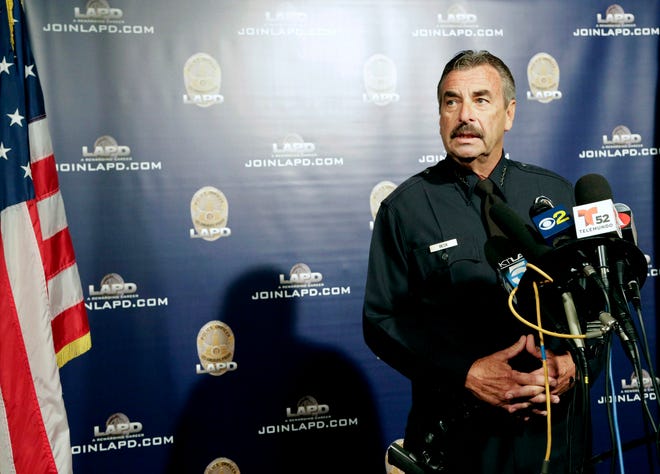 FILE - In this Oct. 4, 2016, file photo, Los Angeles Police Chief Charlie Beck speaks during a news conference in Los Angeles. Beck told the Los Angeles Times on Monday, Nov. 14, 2016, that President-elect Donald Trump’s vows to deport millions after taking office will not affect his department’s longstanding policy of staying out of immigration issues. (AP Photo/Nick Ut, File)