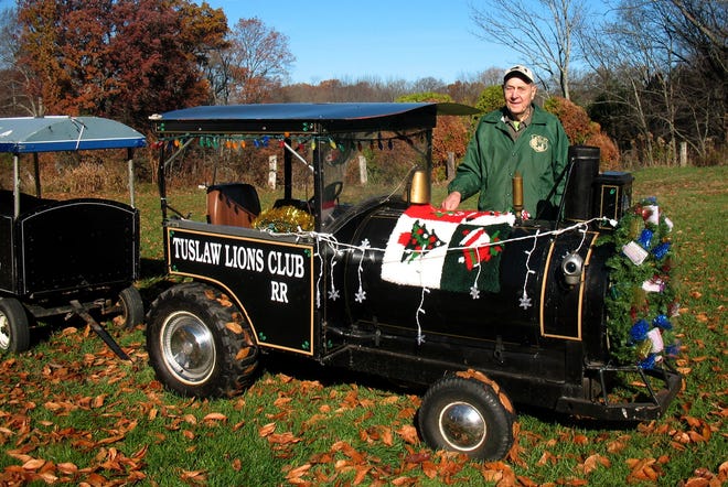 Tuslaw Lions Club member Gus Miller works to prepare the Lions Club miniature train for the holiday parade season, with stops planned in Massillon, Navarre and Green, among others.

(For IndeOnline.com / Joe Shaheen)