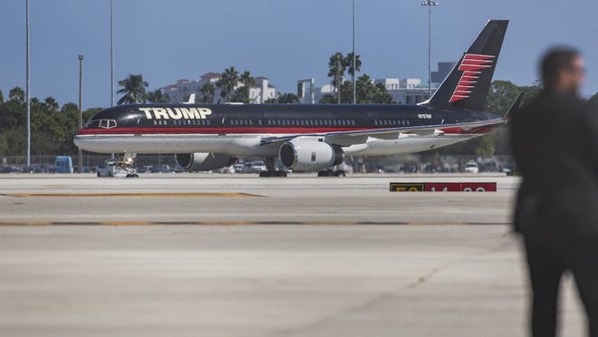 Republican presidential candidate Donald Trump arrives at Palm Beach International Airport aboard his private 757 plane enroute to his campaign rally at the South Florida Fair Expo Center on Oct. 13, 2016 in West Palm Beach. (Greg Lovett / The Palm Beach Post)
