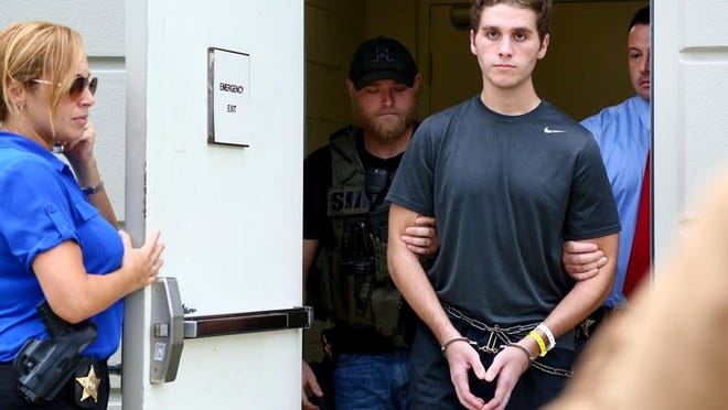 Austin Harrouff is transported by detectives to the Martin County Jail from St. Mary’s Hospital on October 3, 2016. Harrouff, who allegedly fatally stabbed a Martin County couple in their home on August 15th, has officially been charged with two counts of first-degree murder. (Richard Graulich / The Palm Beach Post)