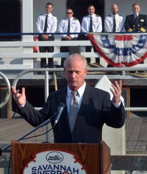 Johnathan Claughton, the owner of Savannah Riverboat Cruises, speaks in front of the 230-foot-long Georgia Queen. (Steve Bisson/Savannah Morning News)