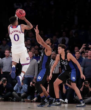Kansas guard Frank Mason readies to take a tiebreaking jumper with 1.2 seconds left in Tuesday night’s 77-75 victory over No. 1-ranked Duke at Madison Square Garden in New York. Mason finished with a team-high 21 points. (The Associated Press)