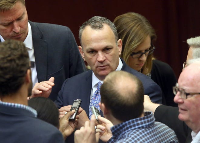Rep. Richard Corcoran, R-Land O' Lakes, surrounded by the Capitol press corps, answers questions after session in 2015. (AP Photo/Steve Cannon)