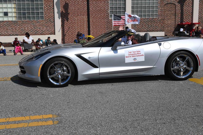 Capt. Sean Haley, commanding officer of Naval Air Station Jacksonville, rides in a Corvette during the City of Jacksonville's annual Veterans Day Parade Nov. 11.