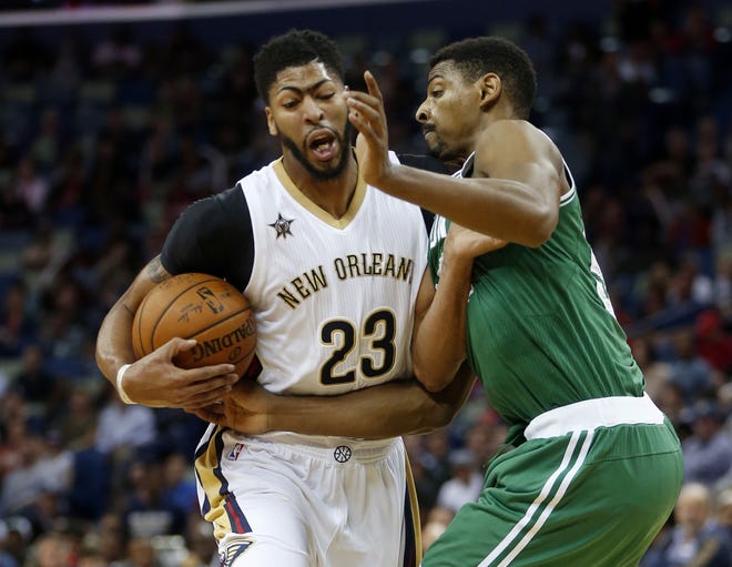 Despite going up against Pelicans star forward Anthony Davis, Celtics forward Jordan Mickey (right) acquitted himself well in Boston's loss on Monday night.