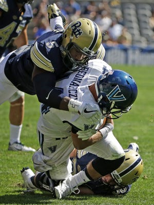 Villanova quarterback Zach Bednarczyk, center, is sacked by Pittsburgh linebacker Mike Caprara, bottom, and Ejuan Price during the first half of a NCAA game in Pittsburgh. Pitt takes on Duke this week after upsetting Clemson. (AP Photo/Gene J. Puskar)