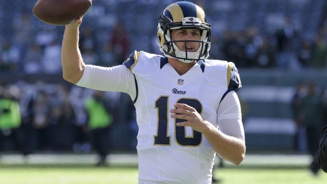 FILE - In this Nov. 13, 2016, file photo, Los Angeles Rams quarterback Jared Goff (16) warms up before an NFL football game against the New York Jets, in East Rutherford, N.J. A person with knowledge of the decision tells The Associated Press that quarterback Jared Goff will make his NFL debut on Sunday when the No. 1 pick starts for the Los Angeles Rams. The source spoke on condition of anonymity Tuesday, Nov. 15, 2016, because Rams coach Jeff Fisher hadn't made the official announcement. (AP Photo/Bill Kostroun, File)