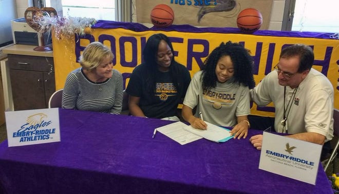 Booker High girls basketball player Cellexia Foster signs with Embry Riddle. A four-year starter for the Tornadoes, Foster averaged 18 points per game last season will posting a 4.2 grade-point average in the Law Academy and dual enrollment programs at Booker High. photo provided