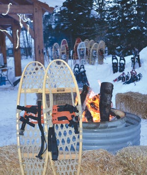 Snowshoes stood up around a bonfire at Tahquamenon Falls State Park are shown. The park is offering a snowshoe making workshop in December. A registration deadline is set for Nov. 30.