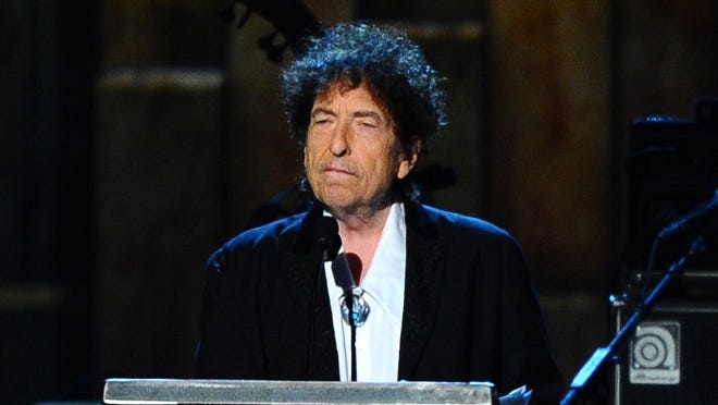 In this Feb. 6, 2015 file photo, Bob Dylan accepts the 2015 MusiCares Person of the Year award at the 2015 MusiCares Person of the Year show in Los Angeles. The Swedish Academy says Dylan is not coming to Stockholm to pick up his 2016 Nobel Prize for literature at the Dec. 10, 2016 prize ceremony. (Photo by Vince Bucci/Invision/AP, File)