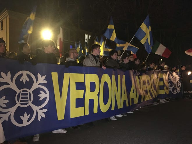 Protesters march in Soave, Northern Italy, Tuesday night, Nov. 15, 2016. More than a thousand people marched under torchlight through the medieval center of the winemaking town of Soave Tuesday night against the government's policy of accepting and housing migrants rescued at sea.