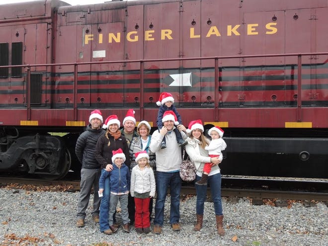 Families prepare to board Geneva Rotary Club’s Santa Train Express, which features Santa Claus and his singing elves, food and holiday activities on board of a Finger Lakes Railway train. PHOTO PROVIDED