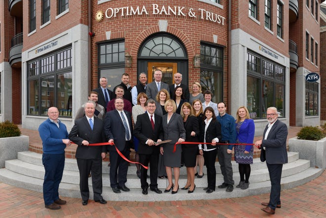 Optima Bank & Trust Chairman and CEO, Daniel Morrison cuts the ribbon marking the official grand opening of the bank’s newest location at 143 Daniel St. in downtown Portsmouth. Courtesy photo