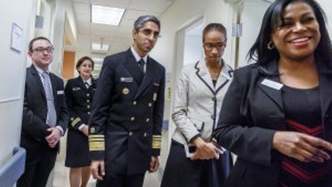 US Surgeon General Vice Admiral (VADM) Vivek H. Murthy, M.D., M.B.A., center, tours FoundCare in West Palm Beach on February 6, 2015. (Thomas Cordy / The Palm Beach Post)