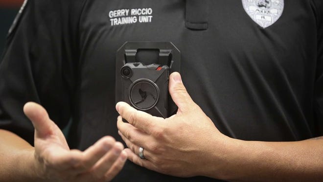 Delray Beach Police Department Training Officer Gerry Riccio demonstrates an Axon Body 2 to members of the media during a body-worn camera show and tell at the department’s Seacrest Training Center Friday, July 1, 2016. The Delray Beach Police Department began the first phase of its body-worn camera program today, with 20 officers wearing the vest-mounted cameras. The goal is to oufit all of the department’s officers within the next three to five years. (Bruce R. Bennett / The Palm Beach Post)
