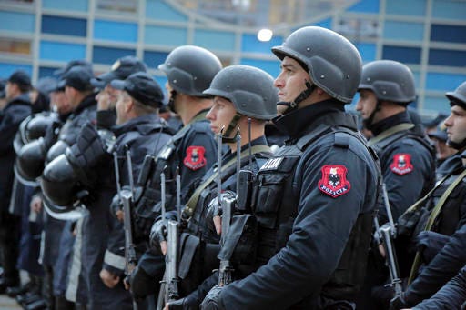 Albanian police get ready in front of the Elbasan Arena, where Albania played their World Cup 2018 qualifying soccer match against Israel under tight security measures in Elbasan, 30 miles south of the capital, Tirana, Saturday.