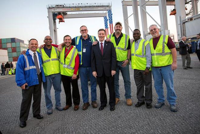 The GPA’s rubber-tired gantry crane team and GPA executive director Griff Lynch marked the 1,000th RTG produced by Konecranes and the completion of its electric RTG infrastructure phase.  (GPA photo by Stephen Morton)