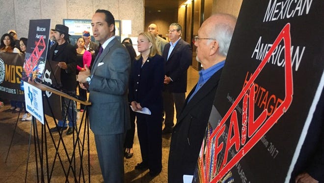State Sen. José Menéndez, D-San Antonio, speaks out against a Mexican-American studies textbook riddled with errors as part of a protest outside a State Board of Education meeting Tuesday.
