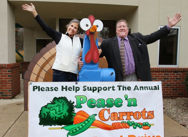 Deb Anthony, Seacoast Family Food Pantry executive director, and Pease 'n Carrots founder and director Mark Sullivan invite Pease International Tradeport employees and visitors to participate in the 9th annual Pease 'n Carrots Holiday Food Drive which runs until Dec. 31. The elaborate turkey was created by Michele Roberge and Ron Tirone of Ipsumm and sits in front of the company's location at 68 New Hampshire Ave.

Photo by Rich Beauchesne/Seacoastonline