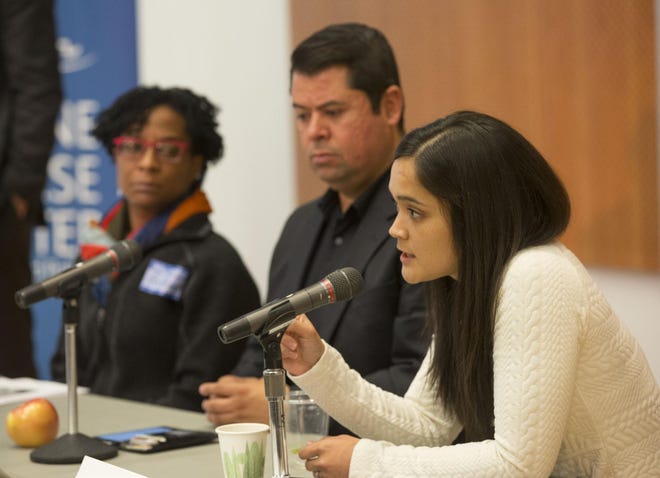 Panelists Kim Williams of Portland State University (left), Phil Carrasco of Grupo Latino de AcciÃ³n Directa, or GLAD, and Andrea Williams of CAUSA answer questions during the forum at the University of Oregon on Thursday. (Chris Pietsch/The Register-Guard)