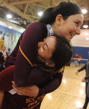 Case junior Hailey Armburg gets the big hug and lift from older sister Megan, who lost a pair of state final matches to Frontier durig her playing days at Case.